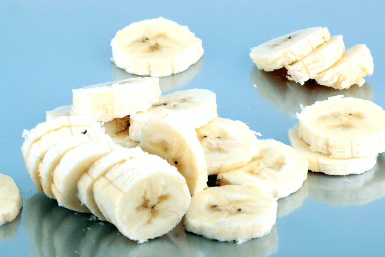 Sliced bananas on a blue background